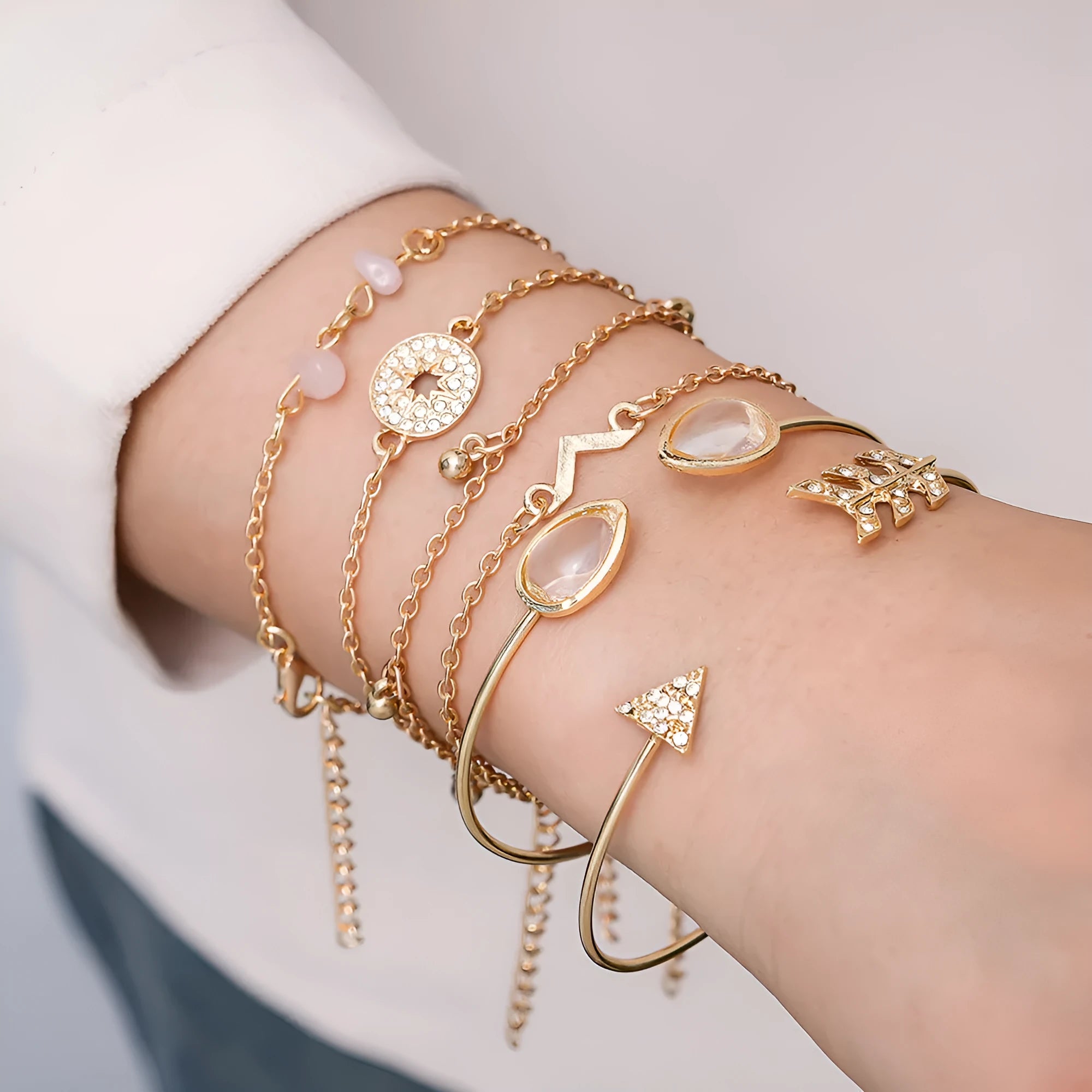Golden spot finish zinc alloy bracelet set with six pieces featuring arrow, water drop and V-shaped geometric designs