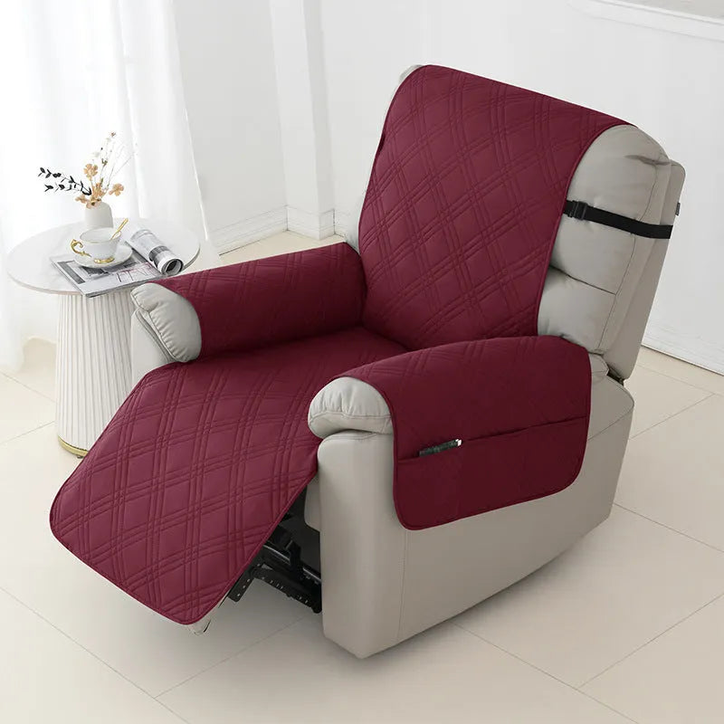 Quilted burgundy sofa cover stretched over a single seat cushion, showing three-line stitching pattern.
