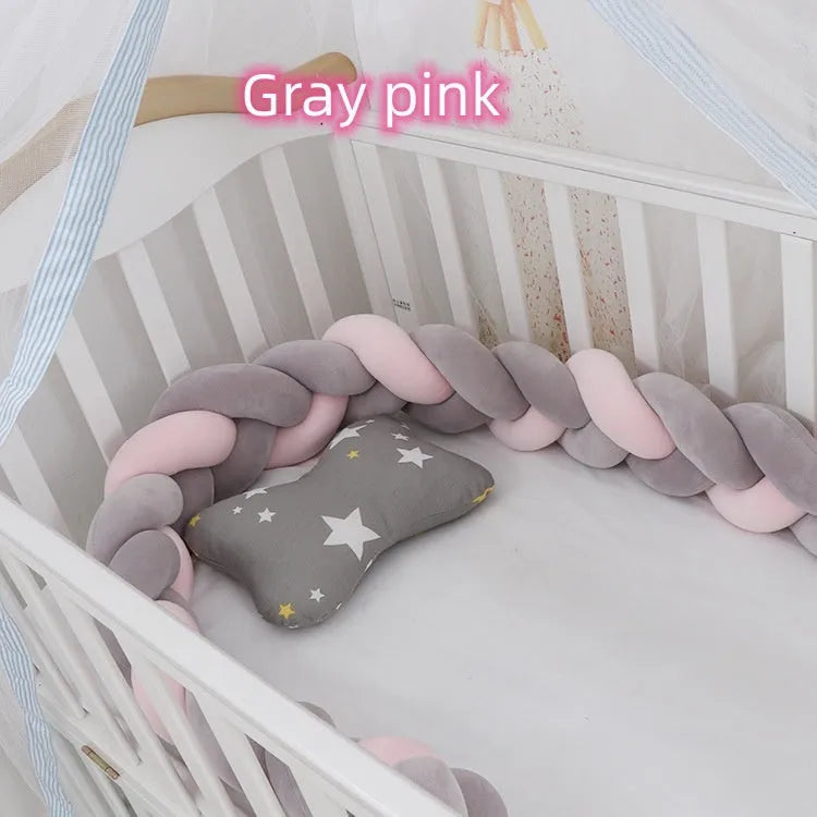 Braided knot design baby crib bumper in spandex velvet, shown in a light grey colour.
