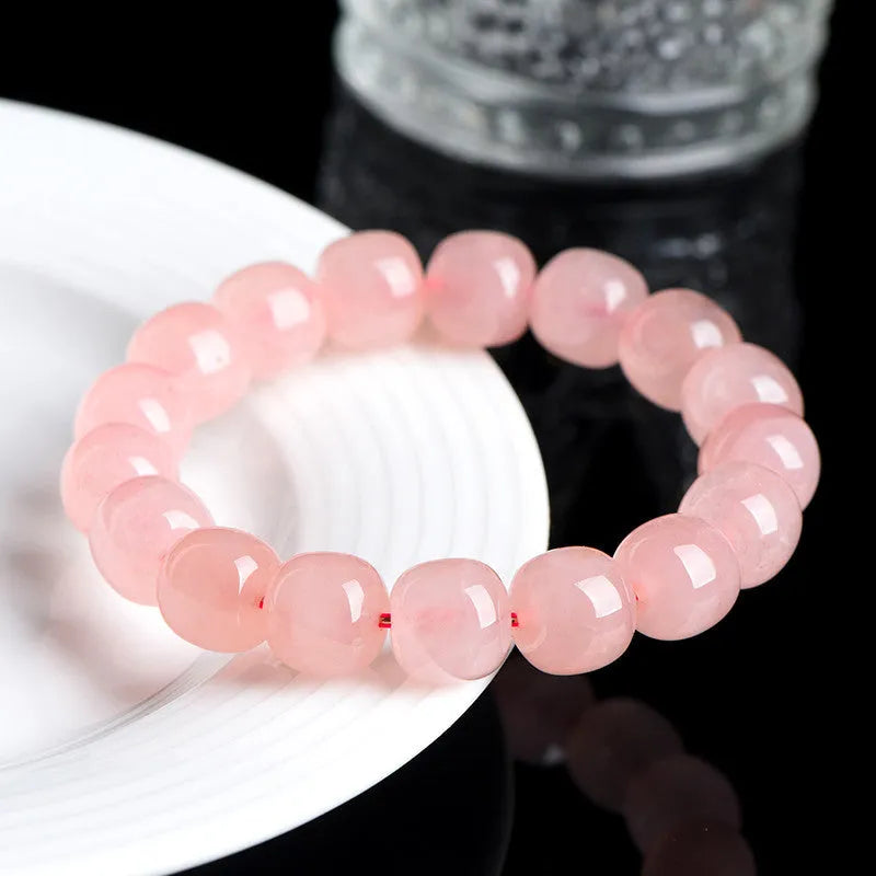 Natural pink crystal bracelet with barrel-shaped geometry beads measuring 8 x 10mm