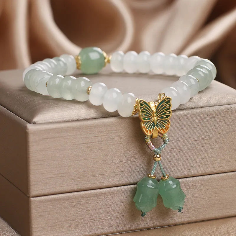 Green crystal abacus bead bracelet with butterfly tassel and pearl rhinestone decoration