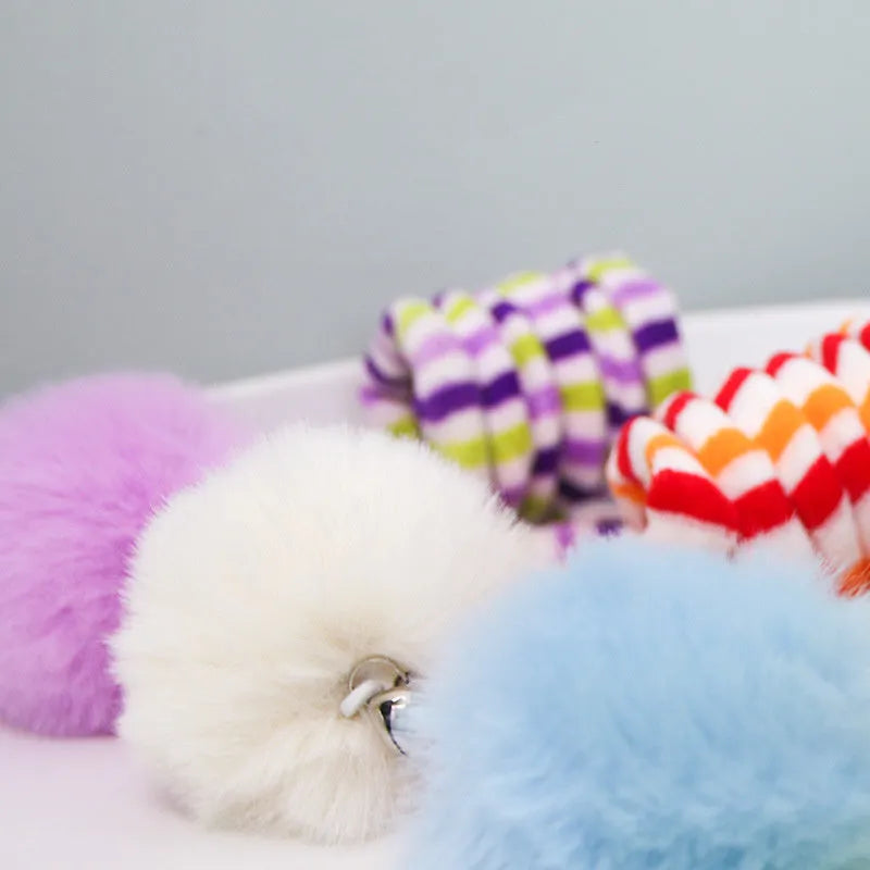 Hanging cat toy with colourful spring bell stick and inflatable ball attached to clear suction cup