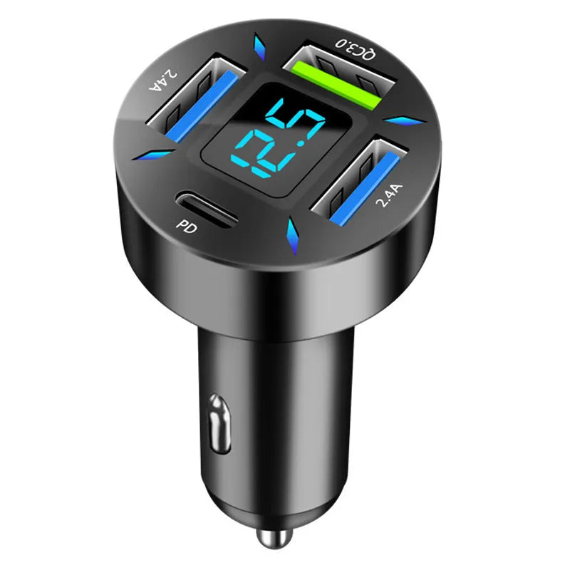 Black four-port USB car charger with LED digital display plugged into a vehicle socket.