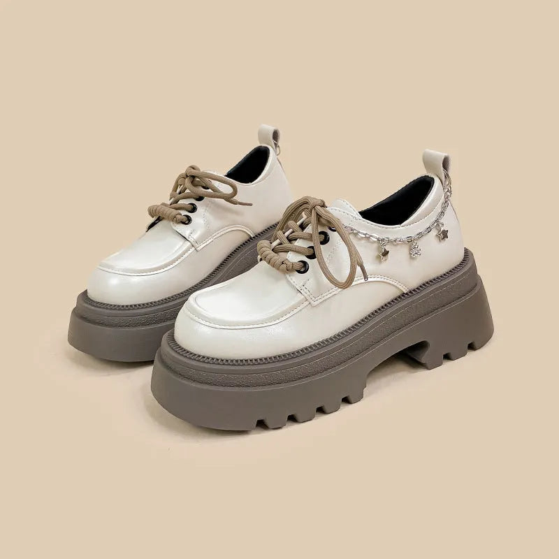 White platform Mary Jane shoes with round toe, lace-up front, and chunky 6-8cm heels
