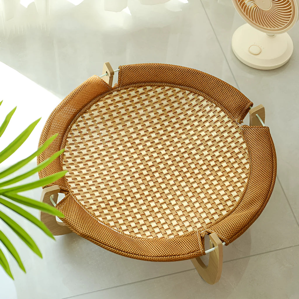 Brown woven rattan hammock pet bed measuring 46cm square with elevated design