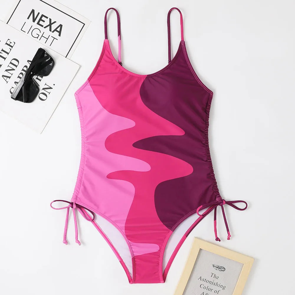Women's blue one-piece sleeveless swimsuit with fixed swimming trunks on a mannequin.