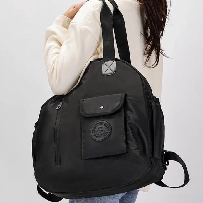 Women's large capacity lightweight nylon backpack in black with sandwich pocket compartments