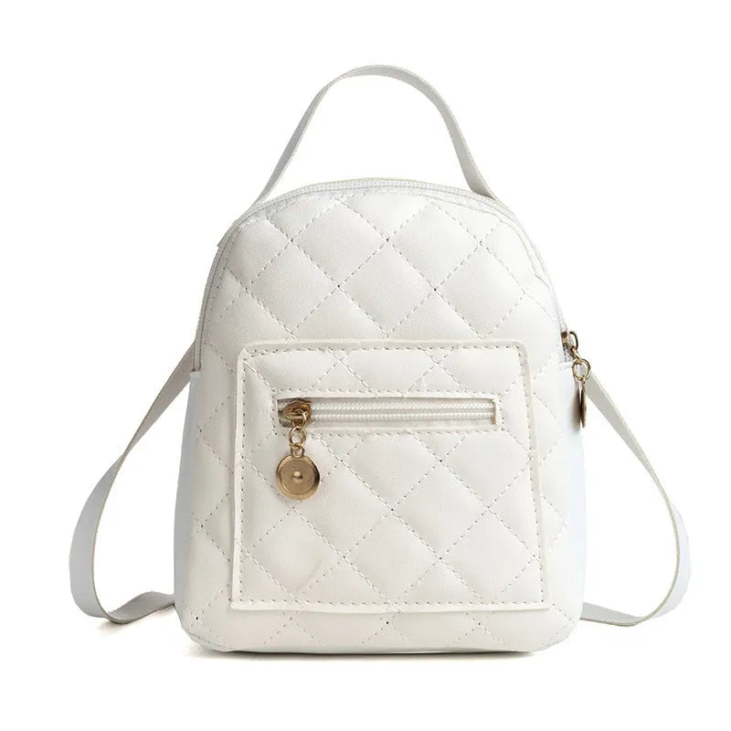 Girls' hard backpack with embroidery in white, black, or pink colours, showing sandwich pocket and soft handle