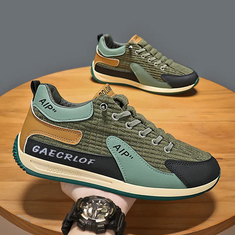 Men's low-top green and grey mesh running shoes with lace-up front.