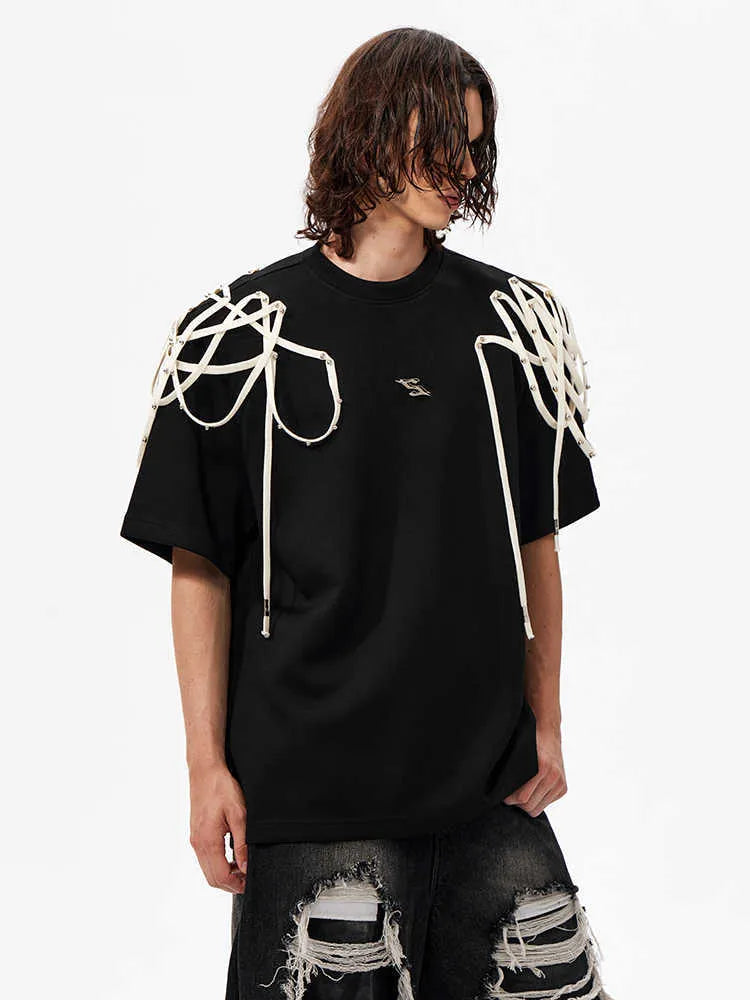 Black loose fit t-shirt with padded shoulders featuring rivet ribbon detail