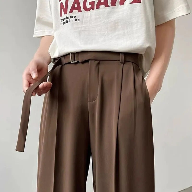 Thin straight wide leg loose fit trousers in black, showing the straight leg opening and casual drape