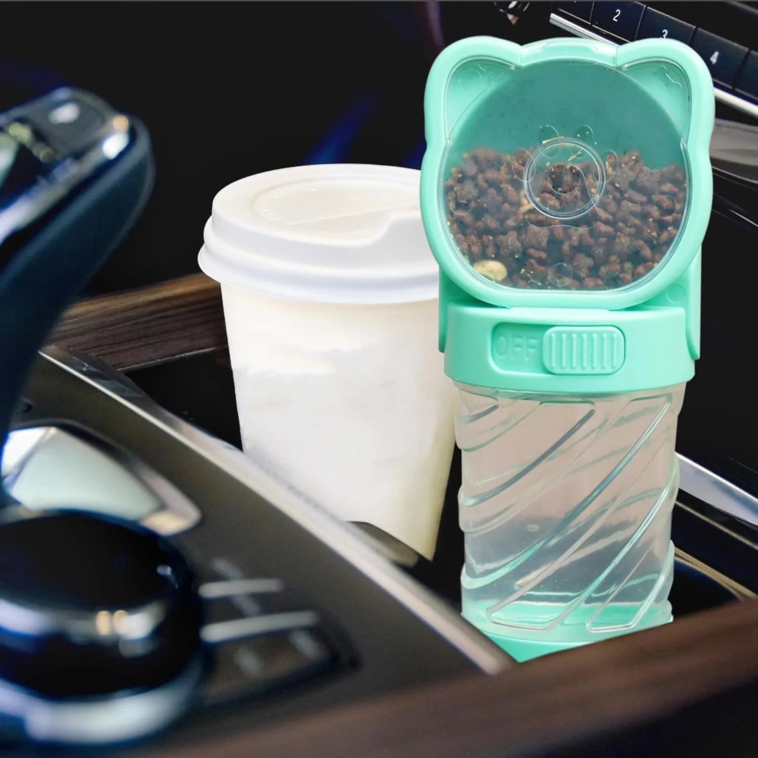 Green 3-in-1 pet water bottle with food container and garbage bag dispenser for dog walking