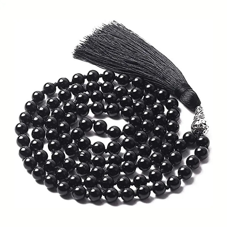 Long beaded agate necklace with geometric stones and a tassel, showing colourful variations.