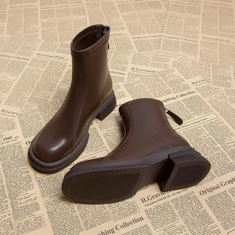 Women's flat heel ankle boots with back zip fastening in black and brown colour options