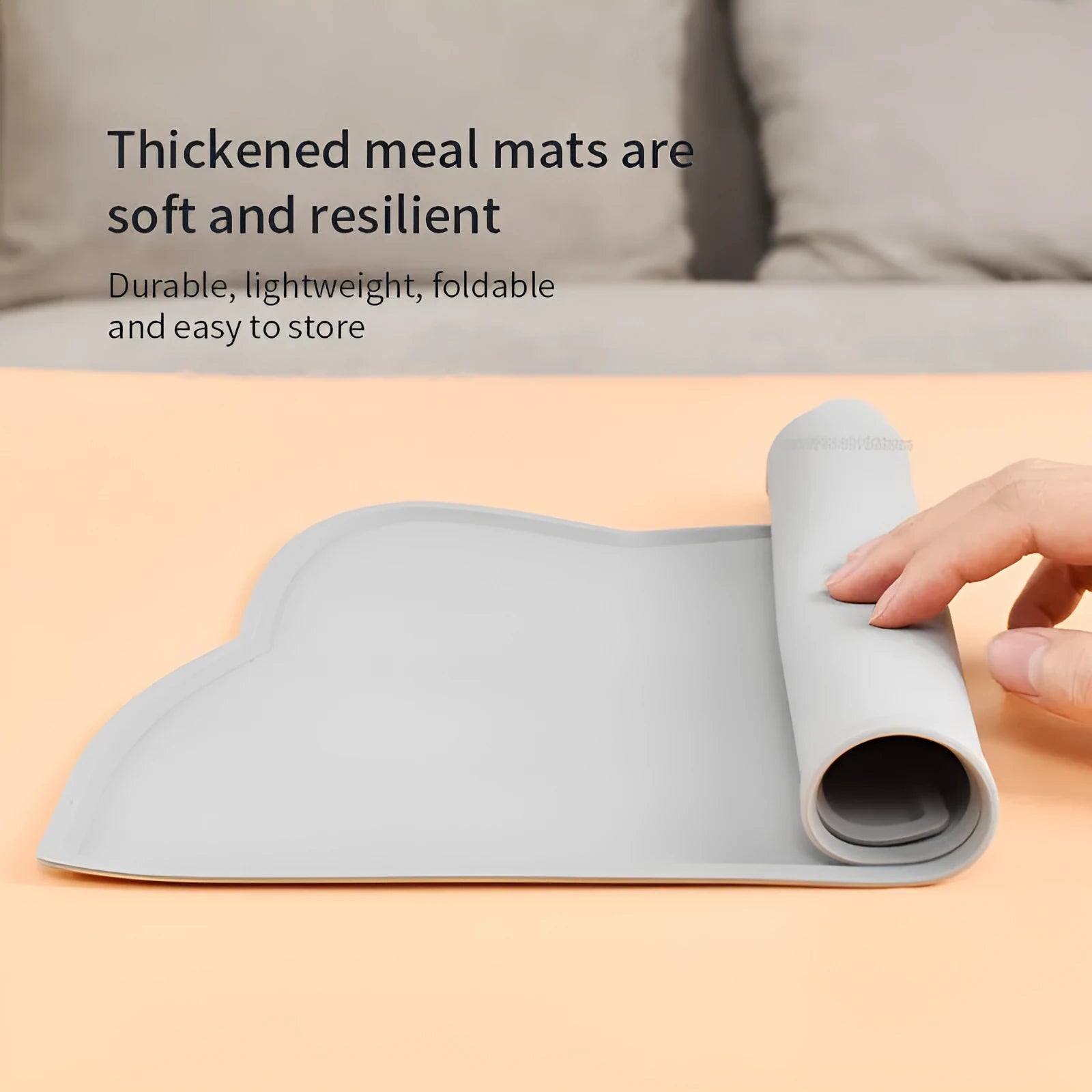Blue silicone pet feeding mat with cat head shape under dog bowl