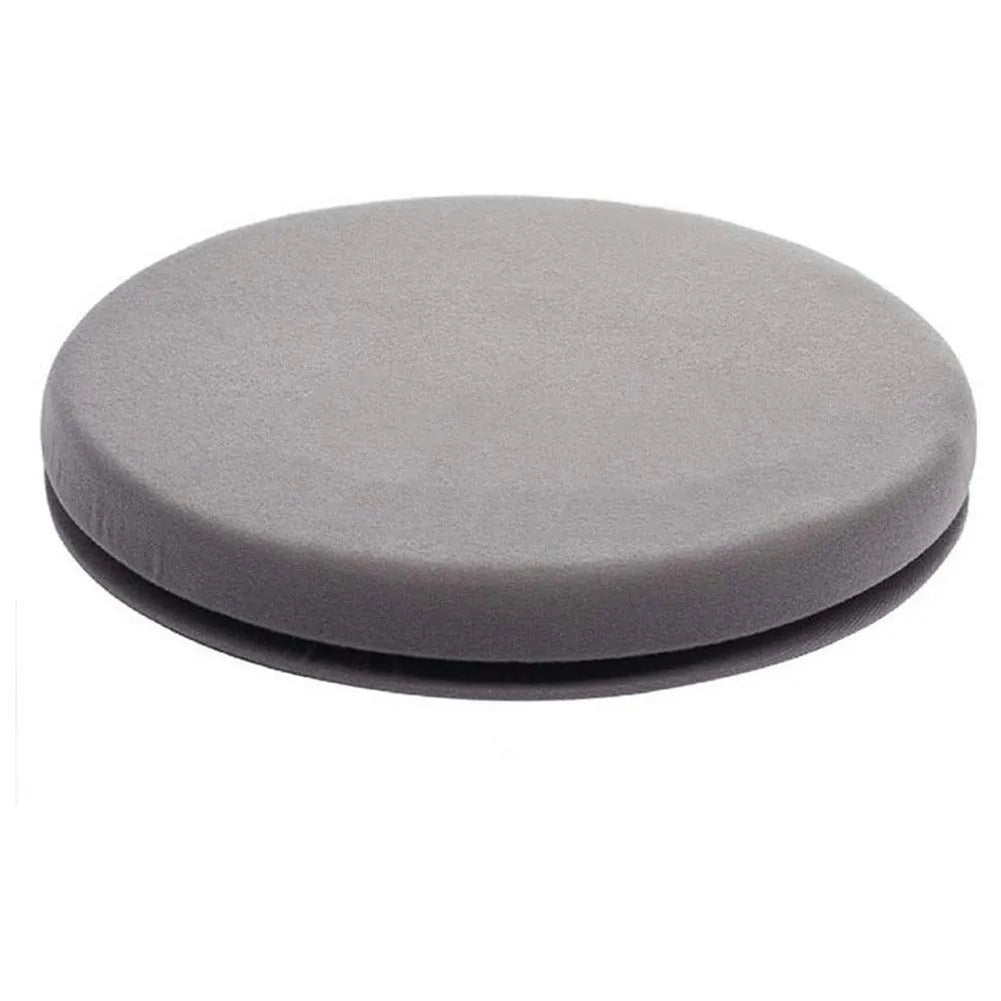 Grey rotating car seat cushion with non-slip base on a car seat, showing swivel function.