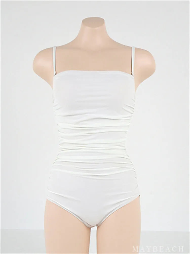 Sling style one-piece swimsuit with belly pleats in a slim fit, shown in blue colour