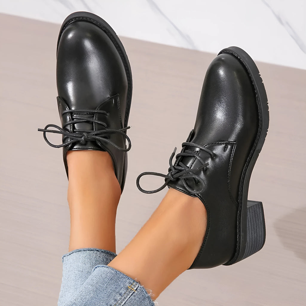 Black women's professional work shoes with chunky heel and pointed toe design