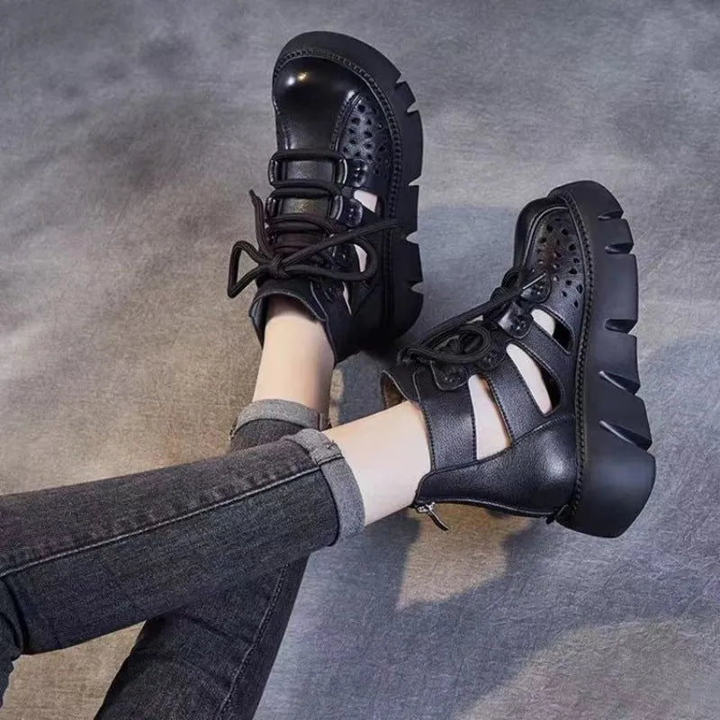 Women's black platform sandals with hollow hole design and fish mouth toe in soft cowhide leather.