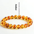 Natural yellow piebald amber bracelet with geometric beads in polished finish