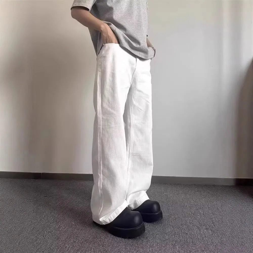 Men's white straight leg jeans with wide leg opening and front zip fly