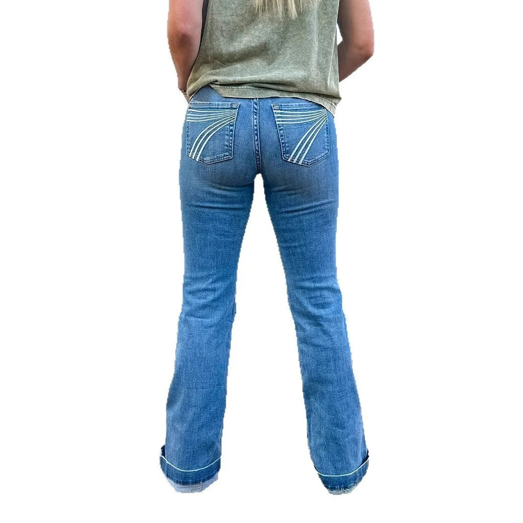 Slim fit blue embroidered jeans with a mid-waist and slightly flared leg on a mannequin.