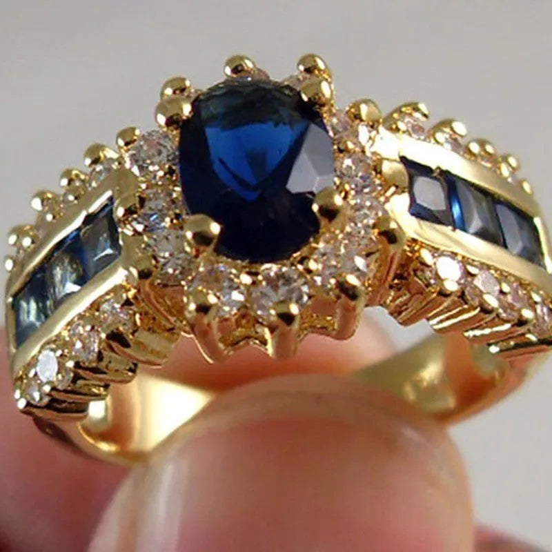Zinc alloy ring with diamond treatment in blue and purple colour options showing unisex design