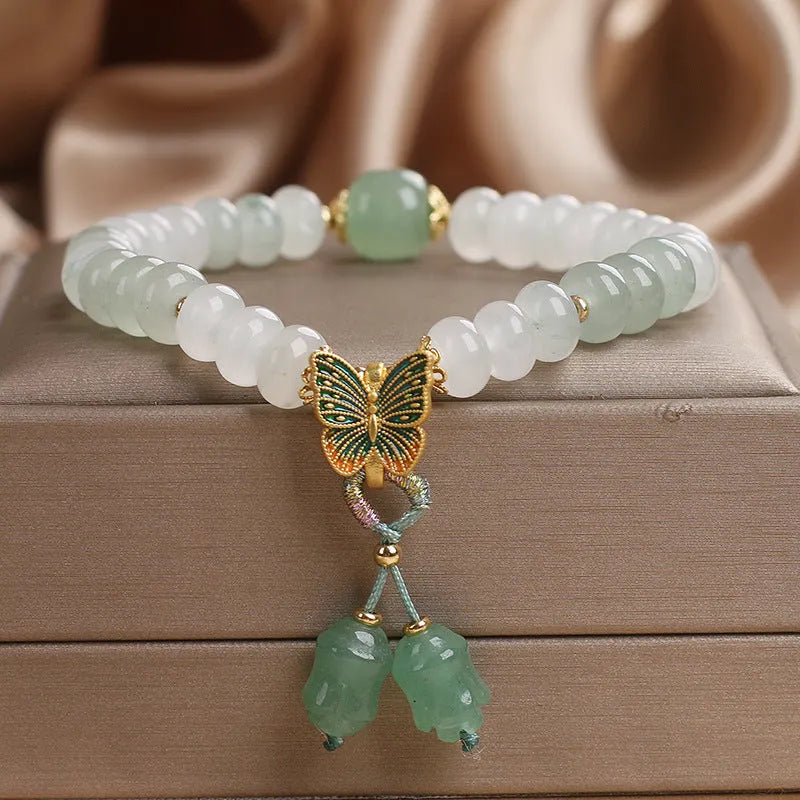 Green crystal abacus bead bracelet with butterfly tassel and pearl rhinestone decoration