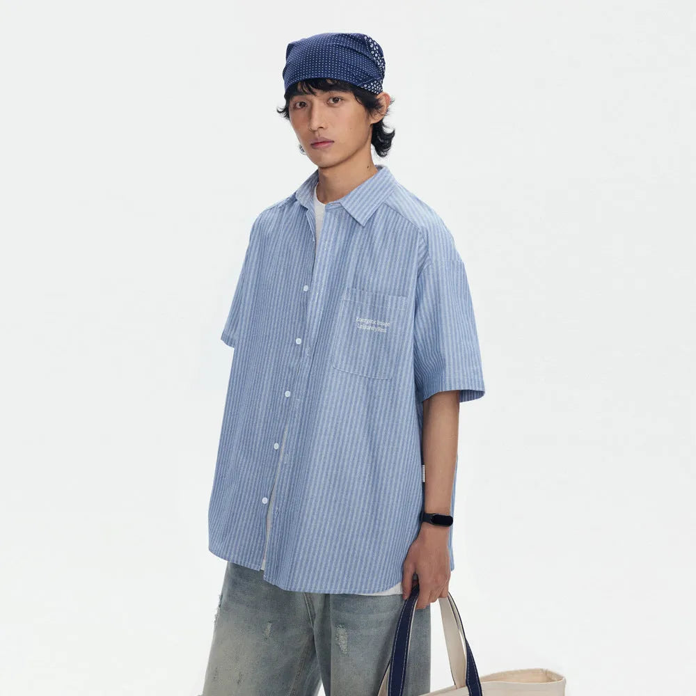 Blue striped short-sleeved shirt cardigan with a loose fit on a hanger.