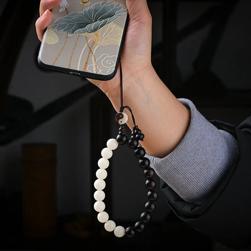 Handmade retro bracelet with White Corypha Umbraculifea Blackwood and Mixed Yuan Beads on a lanyard.
