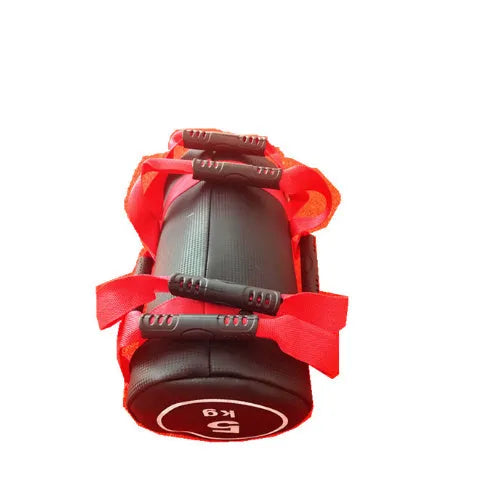 Flat white leather PVC fitness training sandbag shown in a gym setting for weight lifting and conditioning.