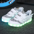 Children's plum red and white LED light up sneakers with USB charging port and hidden mode switch.
