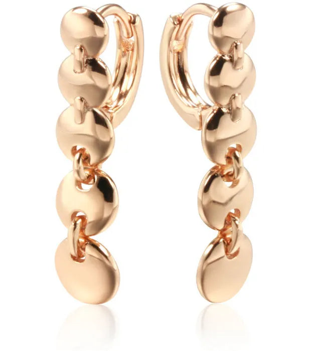 Long gold retro circle earrings with woven chain design, shown from the side.