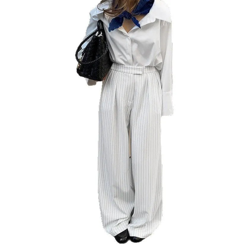 White striped wide-leg commuting trousers with zipper detailing on hanger