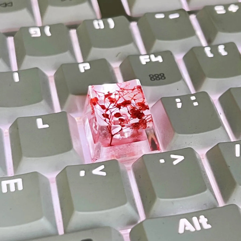 Transparent resin mechanical keyboard keycap with starry sky design in green colour