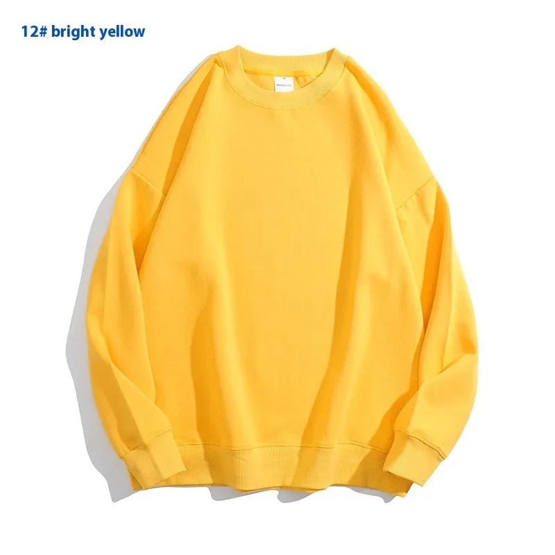 A loose-fitting, light blue off shoulder sweater with long sleeves and a round neck, made from cotton.