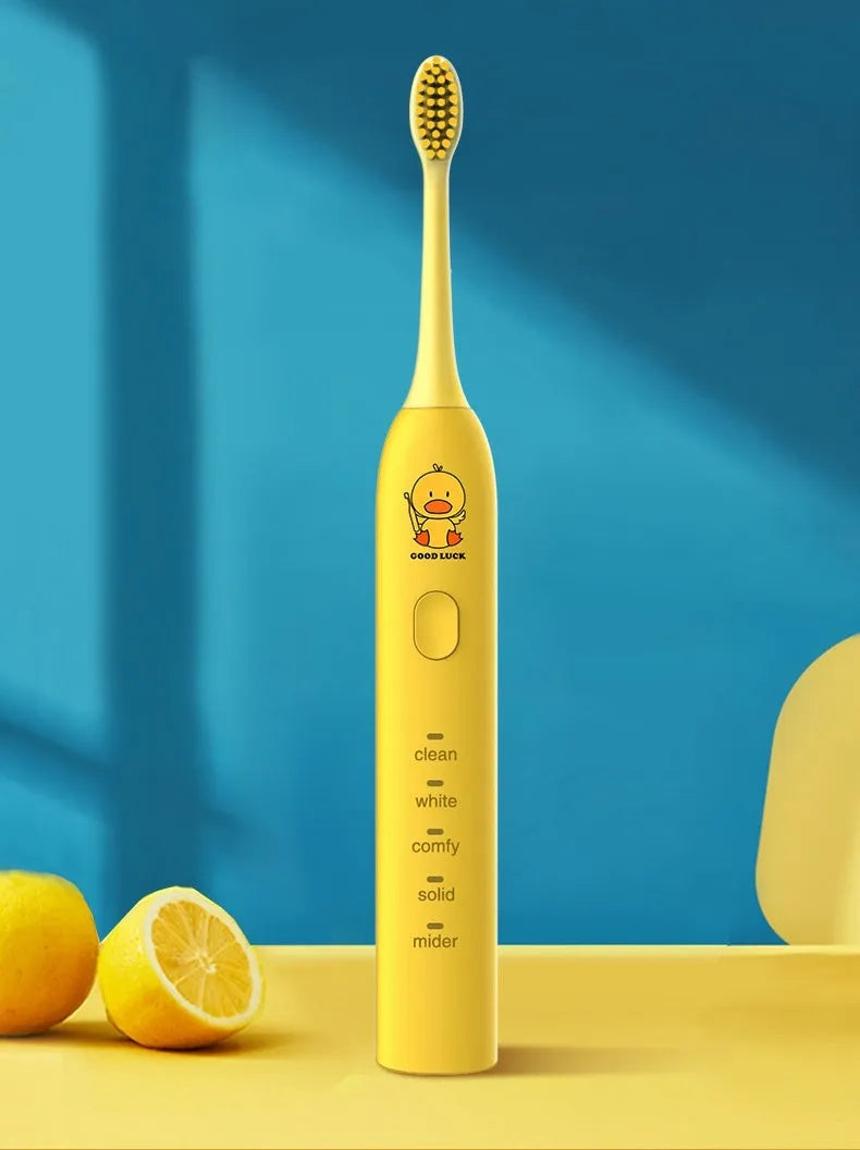 Small yellow duck design USB rechargeable electric toothbrush with soft bristles.