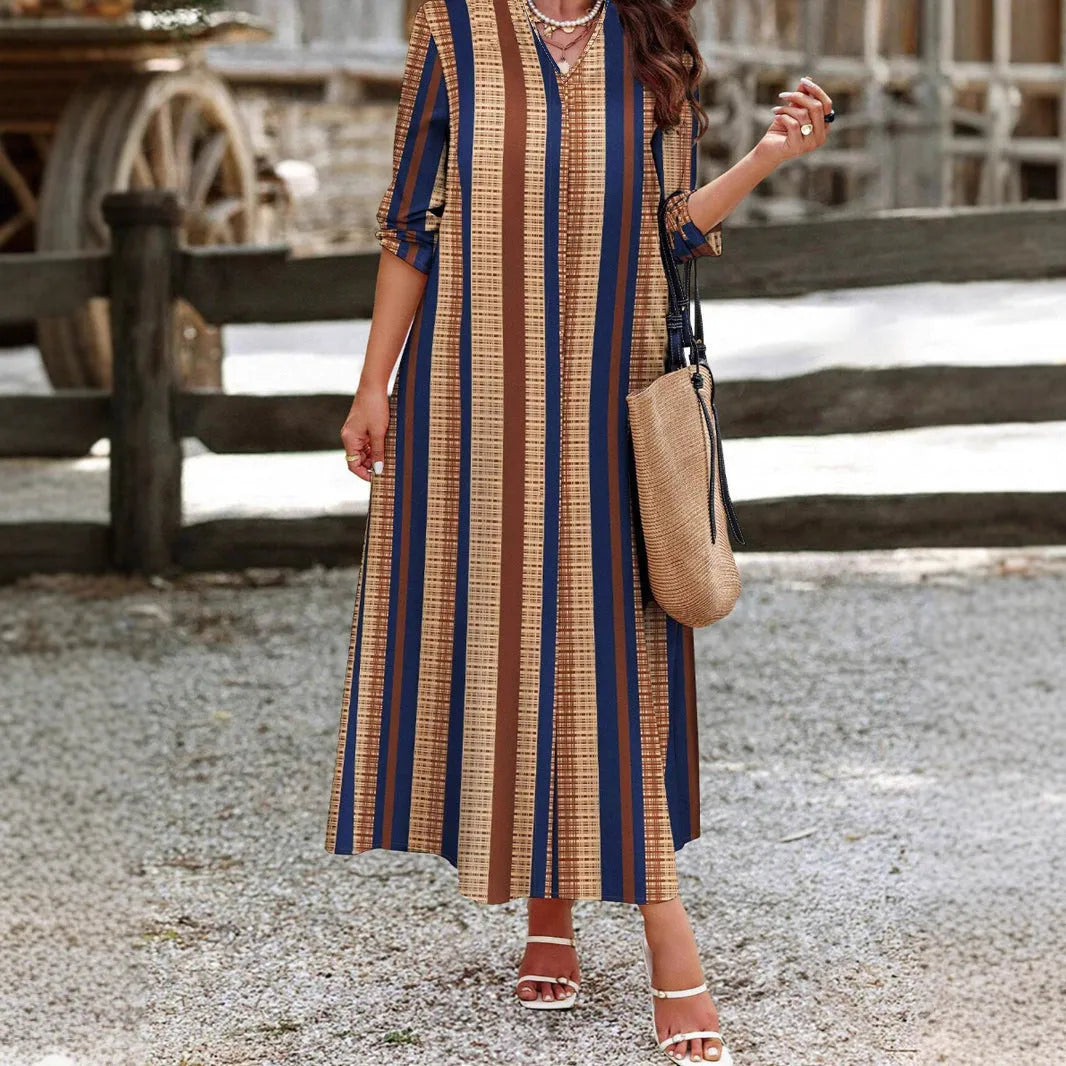 Camel coloured women's vertical striped V-neck long sleeve A-line knitted dress on a hanger.