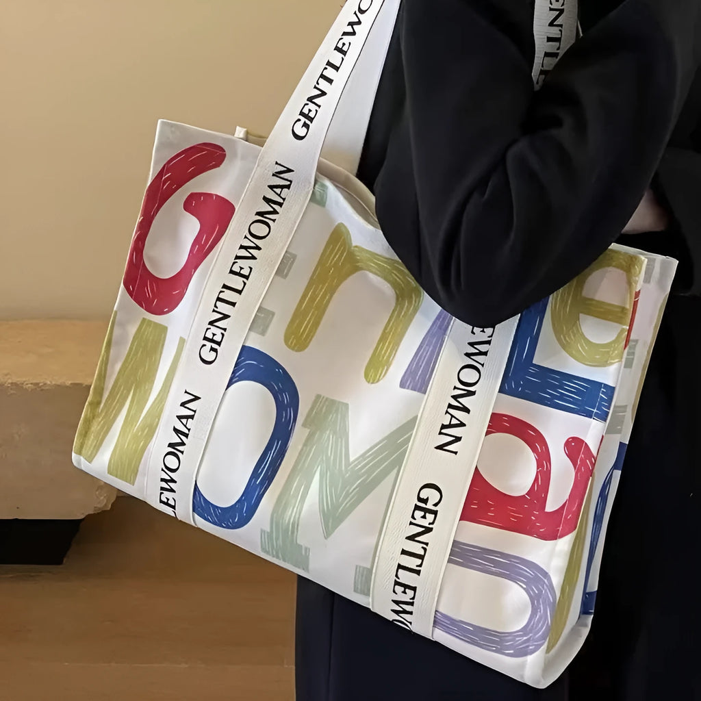 Canvas tote bag with printed design, large capacity for shopping and travel