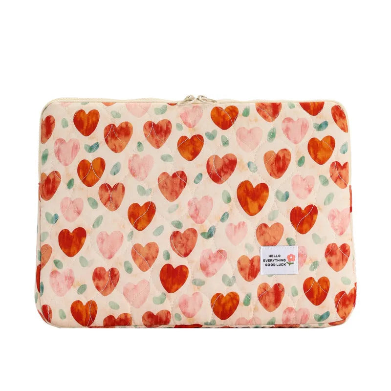 Printed cloth laptop bag for women shown in floral and heart patterns, available in small, medium, and large sizes.