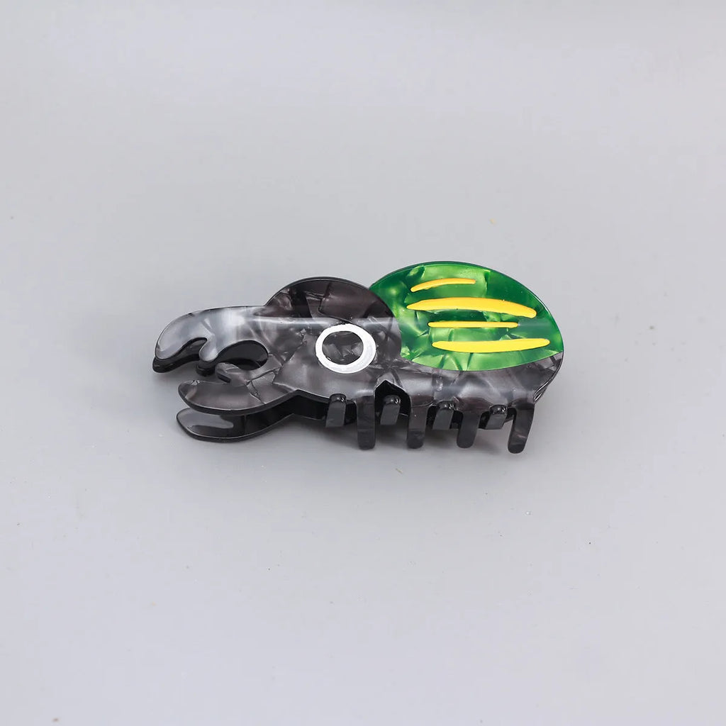 Handmade cellulose acetate beetle grip accessory in green, orange or white insect biology colours