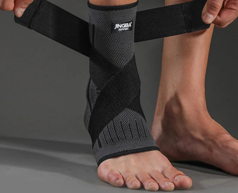 Adjustable sports ankle support in black colour showing strap closure system