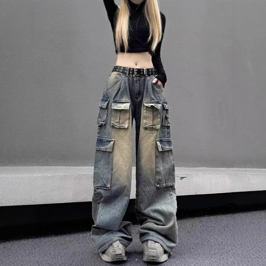 Light blue distressed denim pants with multiple pockets and straight leg loose fit