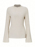Black slim fit long sleeve polyester top with round neck and lantern sleeves on a hanger