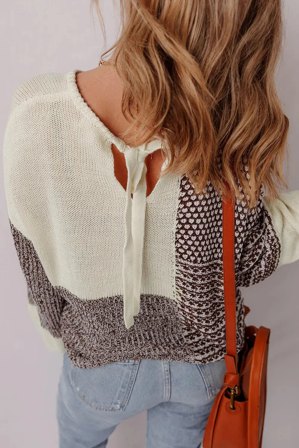 Dark khaki colour block women's loose knit sweater with drop shoulders and a back tie fastening.