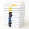 Set of 12 striped cotton dish towels in mixed colours including black, blue, brown, yellow on a kitchen surface