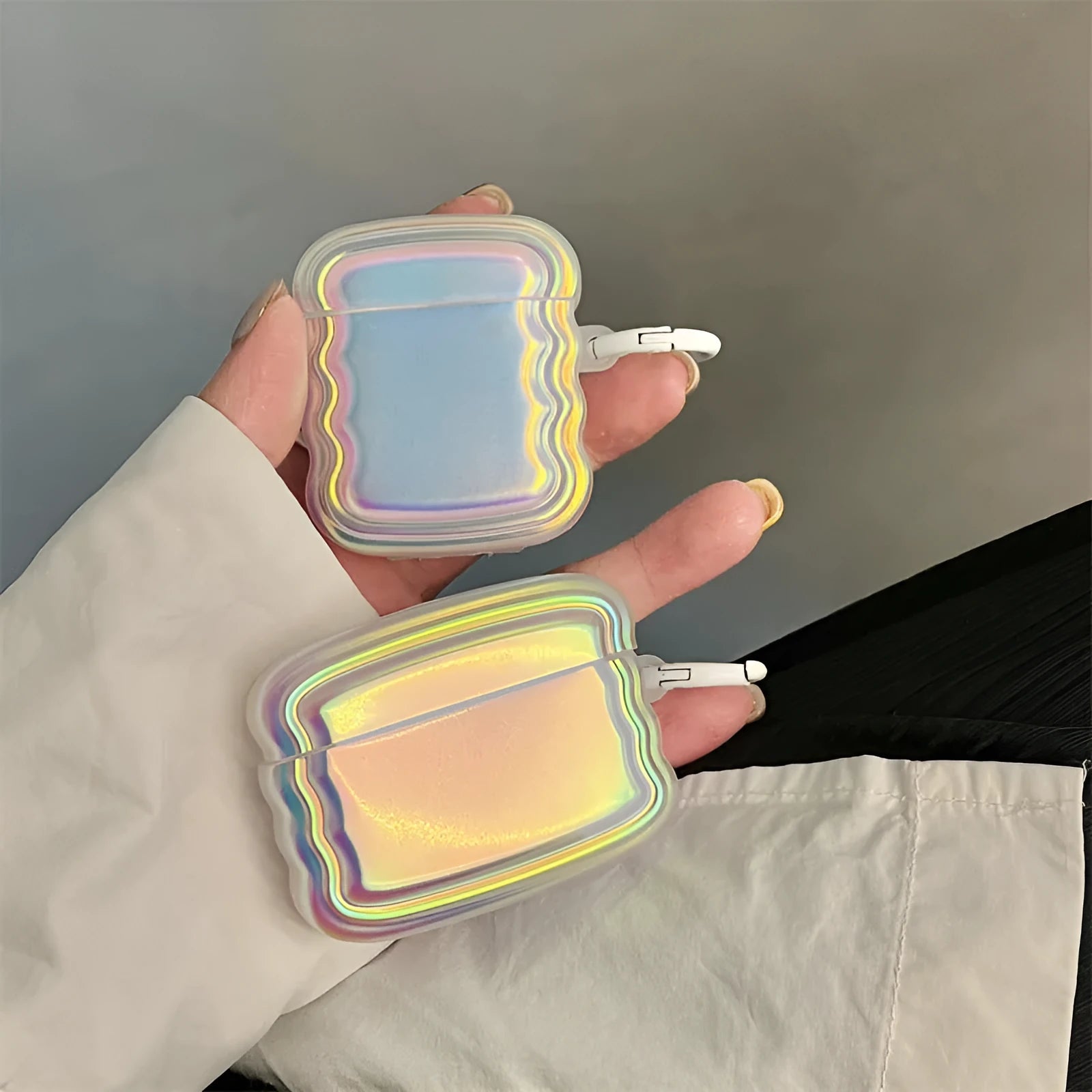 Silicone AirPod case with holographic laser design and metal ring for multiple AirPod models