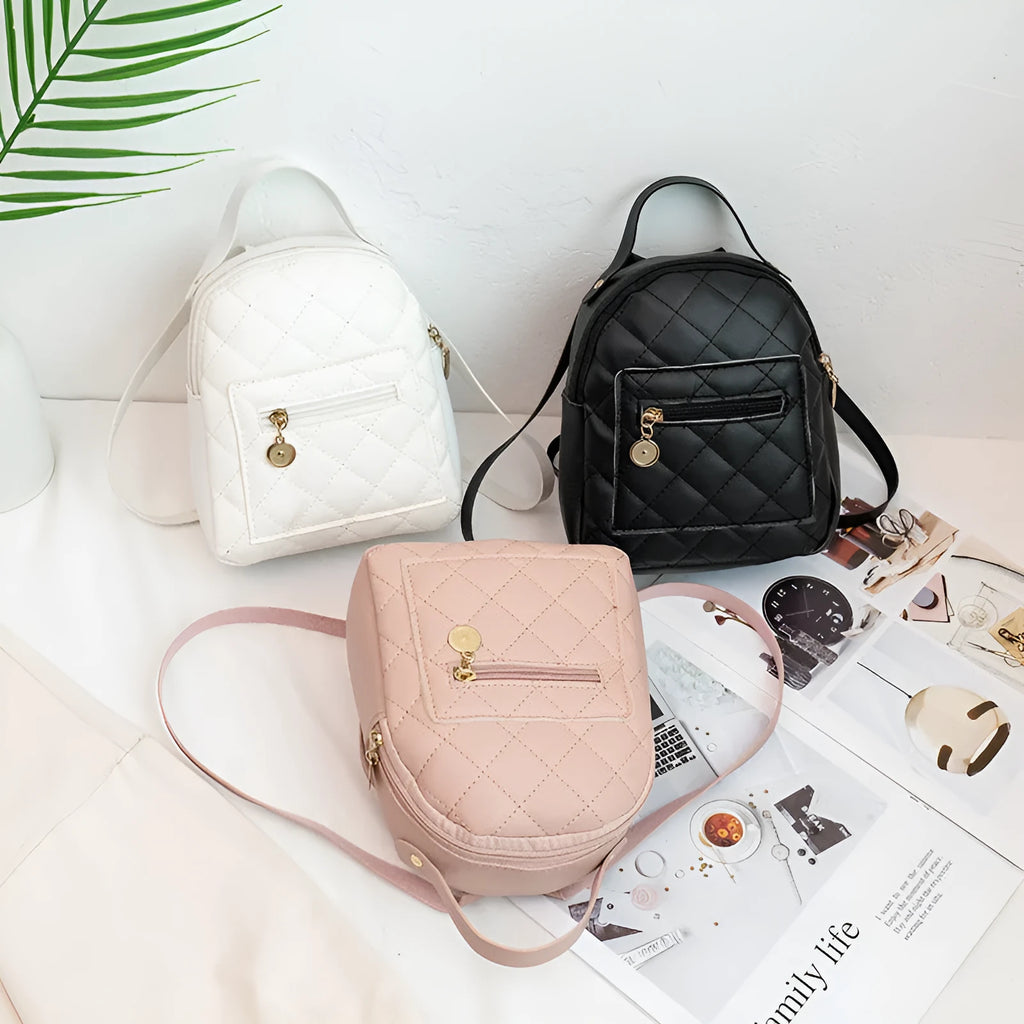 Girls' hard backpack with embroidery in white, black, or pink colours, showing sandwich pocket and soft handle