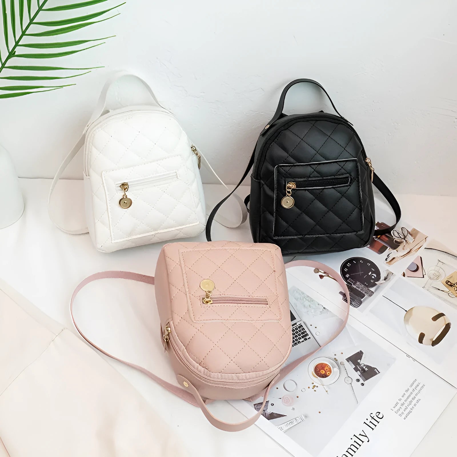 Girls' hard backpack with embroidery in white, black, or pink colours, showing sandwich pocket and soft handle