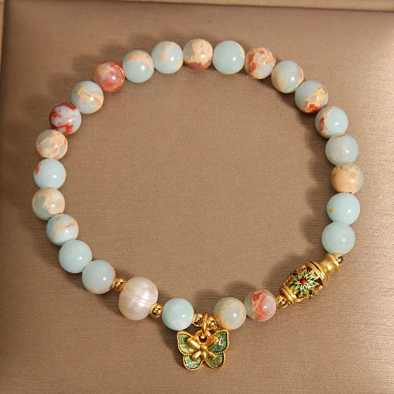 Blue women's bracelet with butterfly pendant, freshwater pearl, and Shoushan Stone elements
